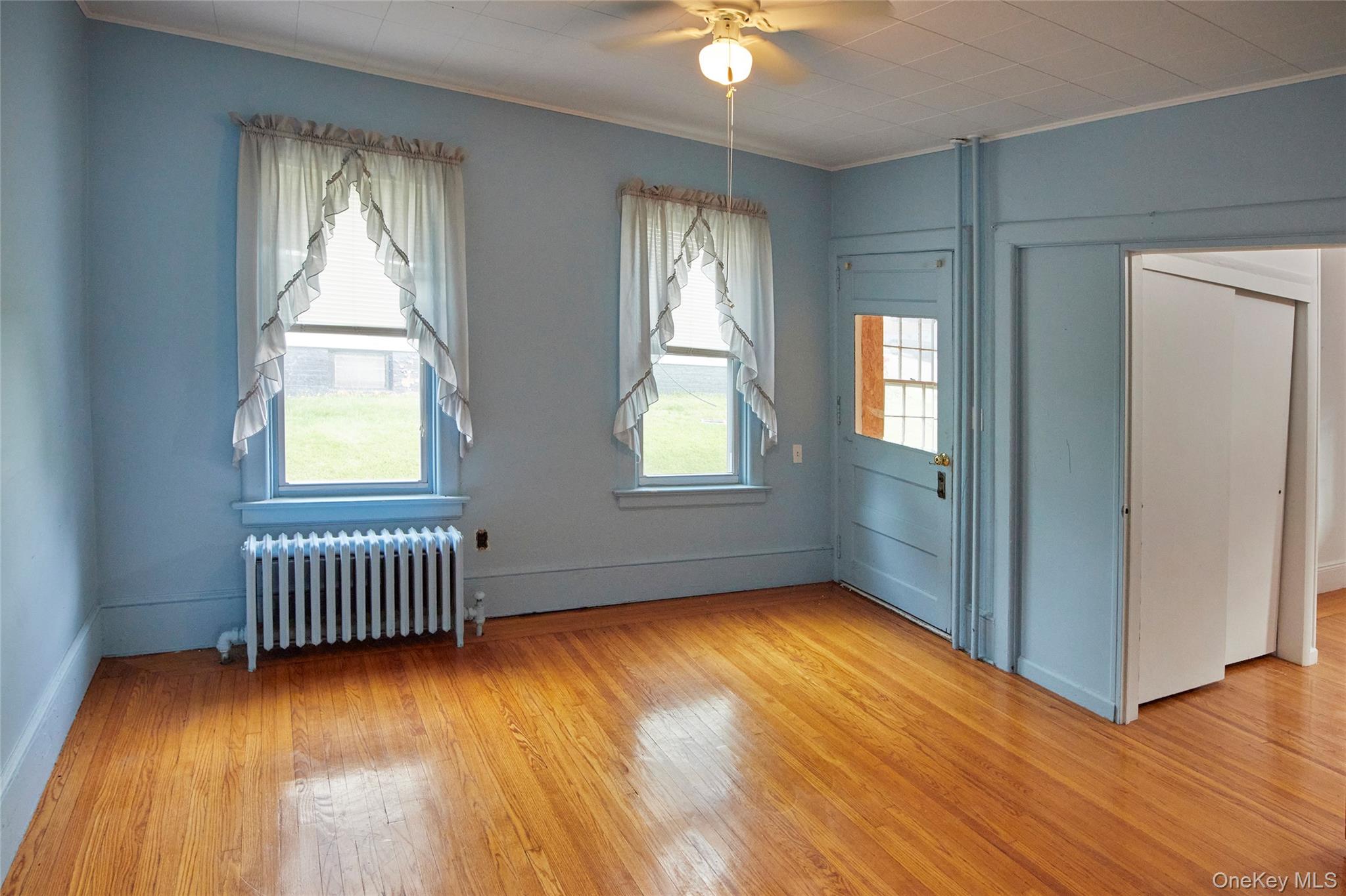 728 Frost Avenue Peekskill, NY 10566 - Photo 7 of 18 an empty room with windows