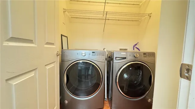 a utility room with dryer and washer