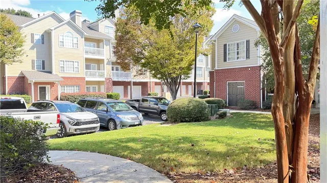 a view of a front of a house with a yard