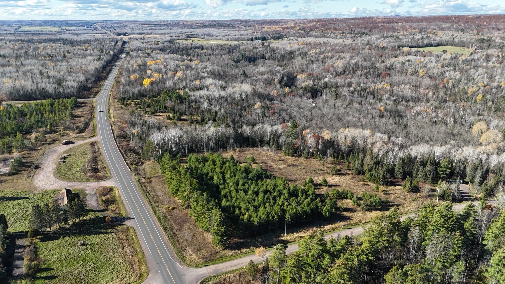 2 U.S. Highway 2 Ashland, WI 54806 - Photo 8 of 10 Aerial view of property and surrounding area featuring a heavily wooded area