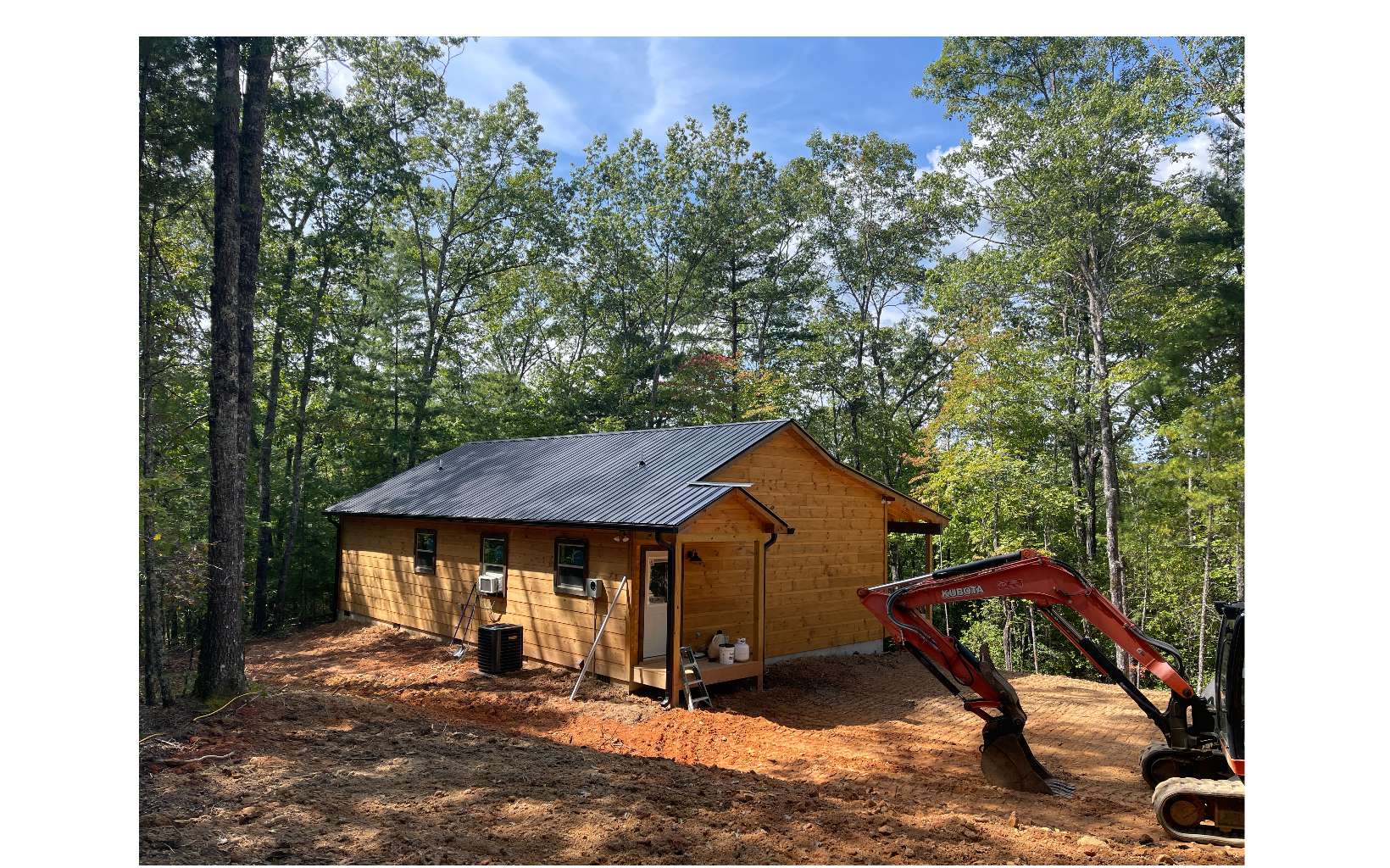 504 Rye Field Road Murphy, NC 28906 - Photo 15 of 16 a view of a small house with yard and sitting area