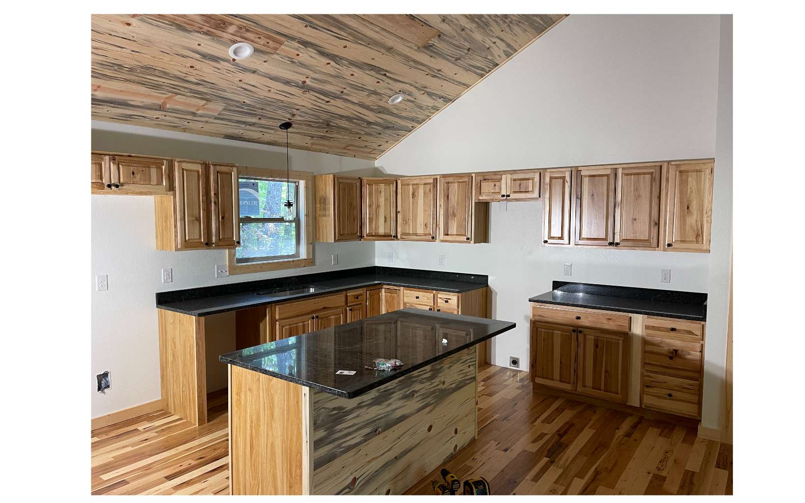 504 Rye Field Road Murphy, NC 28906 - Photo 2 of 16 a kitchen with granite countertop a sink a counter space and cabinets