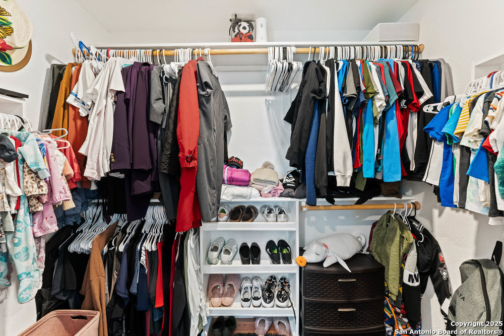 1410 Kayton Avenue San Antonio, TX 78210 - Photo 13 of 28 a view of walk in closet with clothes