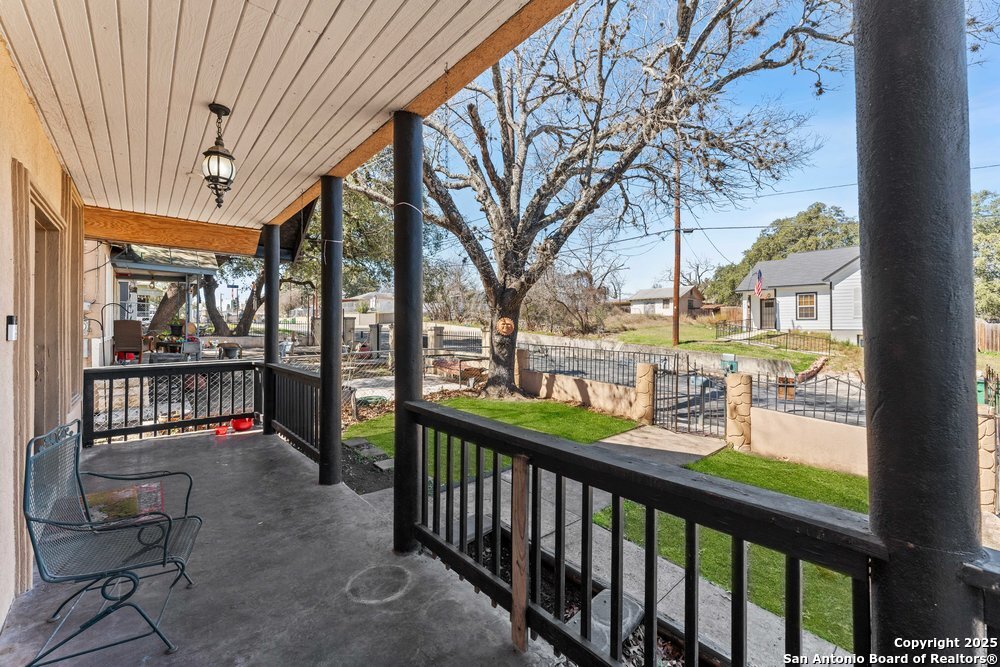 1410 Kayton Avenue San Antonio, TX 78210 - Photo 18 of 28 a view of a porch with wooden floor and outdoor seating