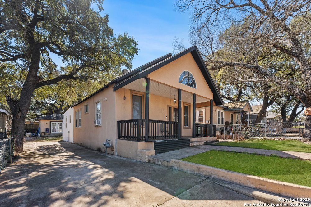 1410 Kayton Avenue San Antonio, TX 78210 - Photo 19 of 28 a view of a white house with a yard and large tree