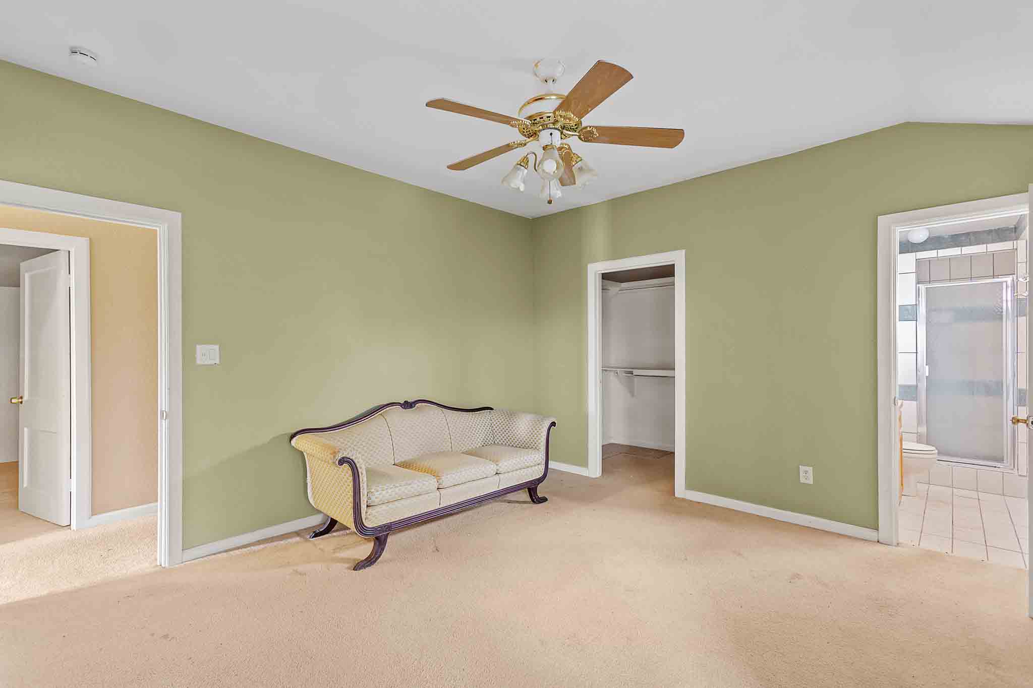 4525 Bell Springs Road Dripping Springs, TX 78620 - Photo 23 of 39 a living room with furniture and a ceiling fan
