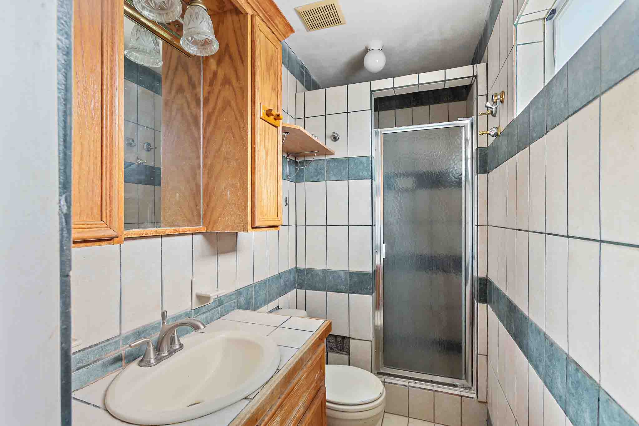 4525 Bell Springs Road Dripping Springs, TX 78620 - Photo 24 of 39 a bathroom with a sink toilet and shower