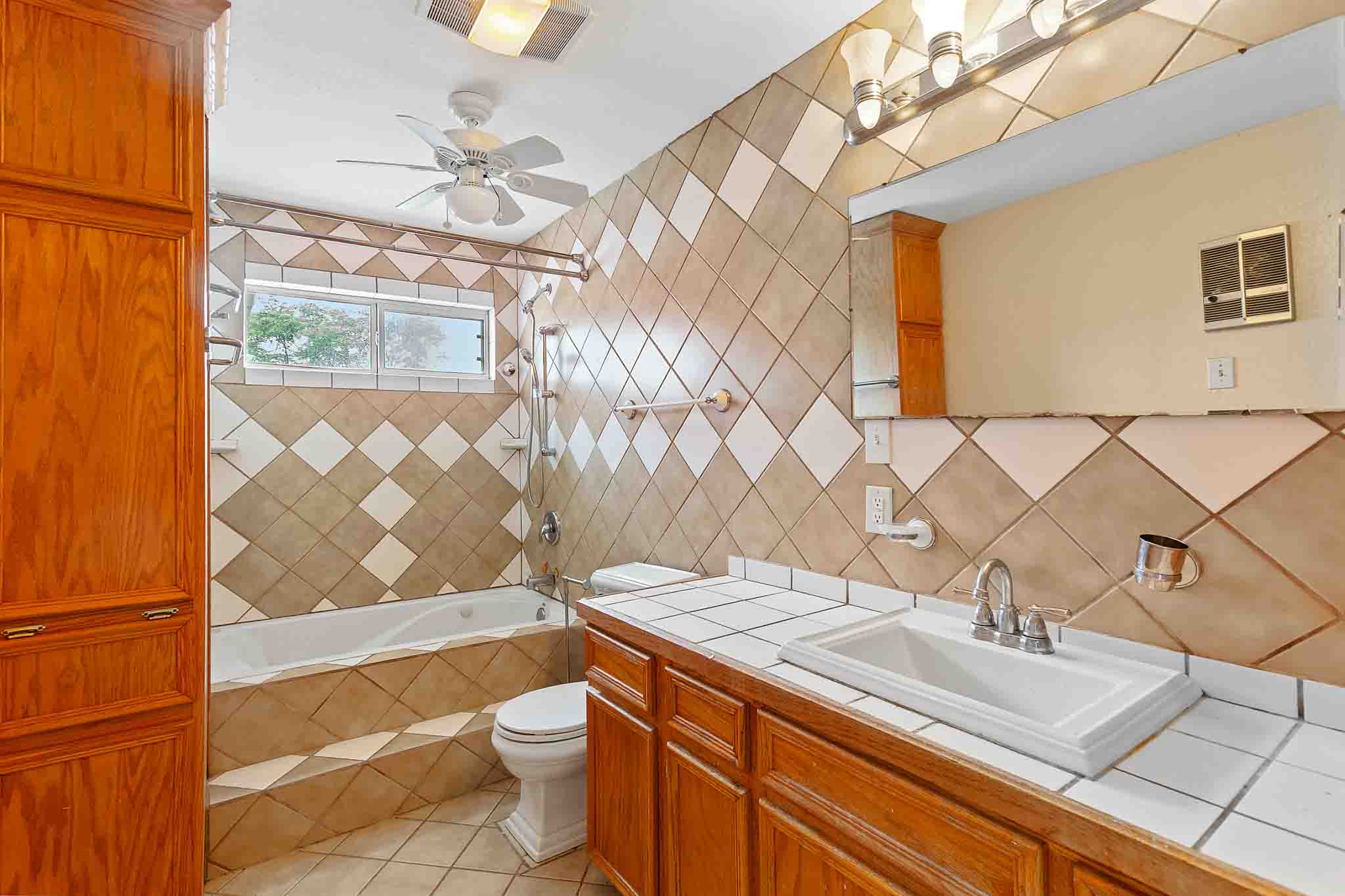 4525 Bell Springs Road Dripping Springs, TX 78620 - Photo 27 of 39 a bathroom with a sink a toilet and shower curtain