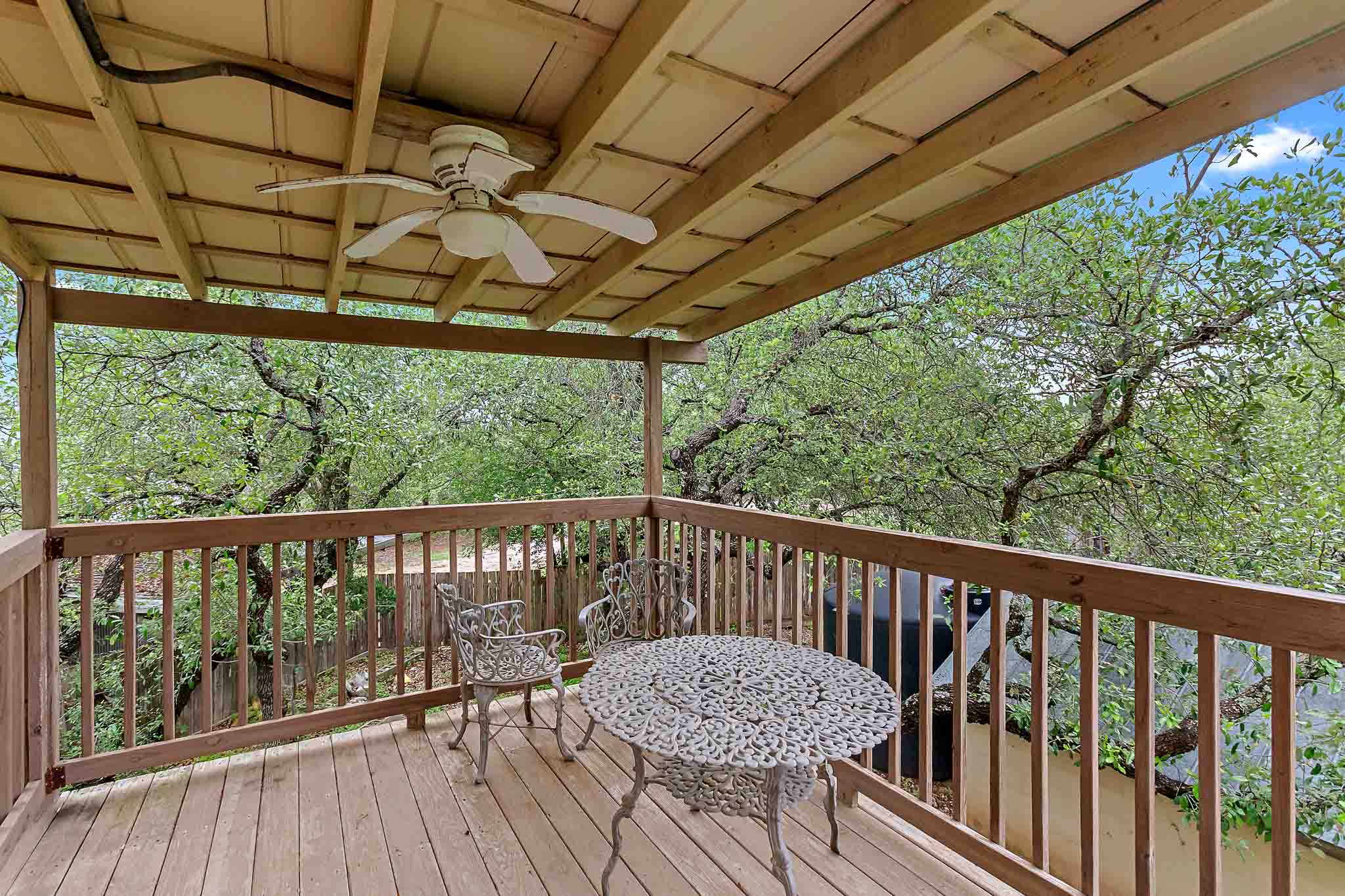 4525 Bell Springs Road Dripping Springs, TX 78620 - Photo 31 of 39 a view of a chair and table in the balcony