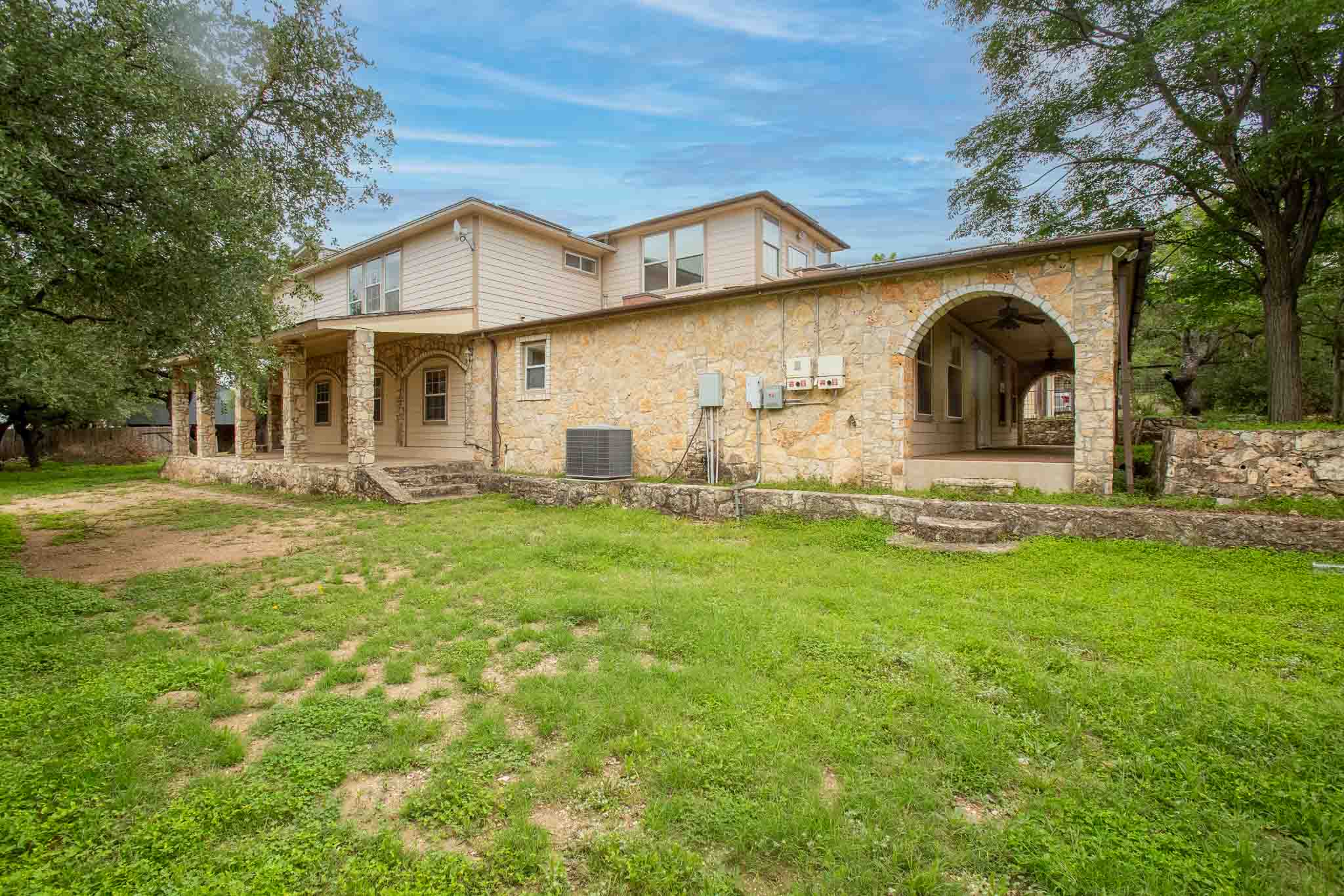 4525 Bell Springs Road Dripping Springs, TX 78620 - Photo 5 of 39 a front view of a house with garden