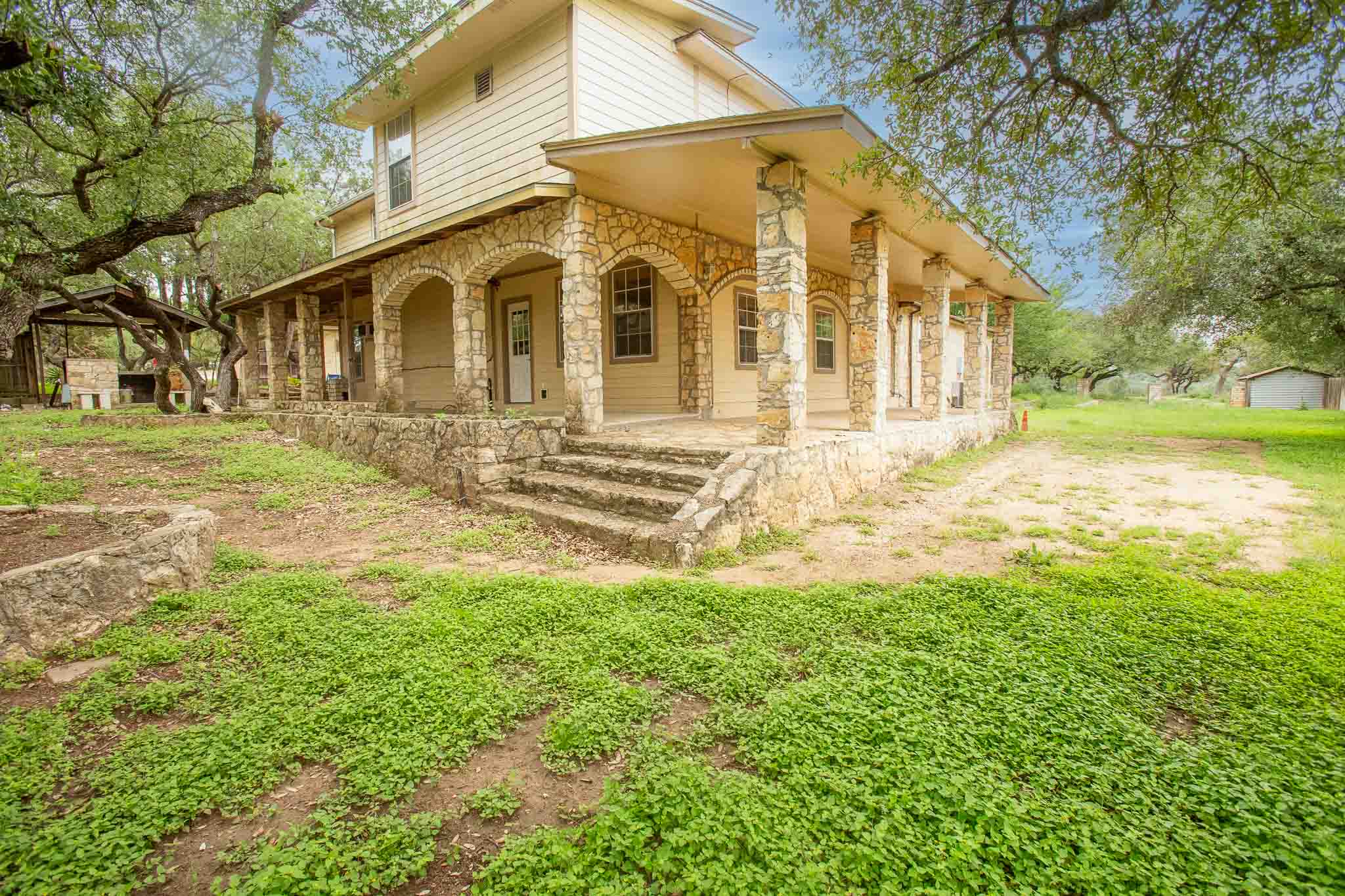 4525 Bell Springs Road Dripping Springs, TX 78620 - Photo 6 of 39 a view of a yard with a house