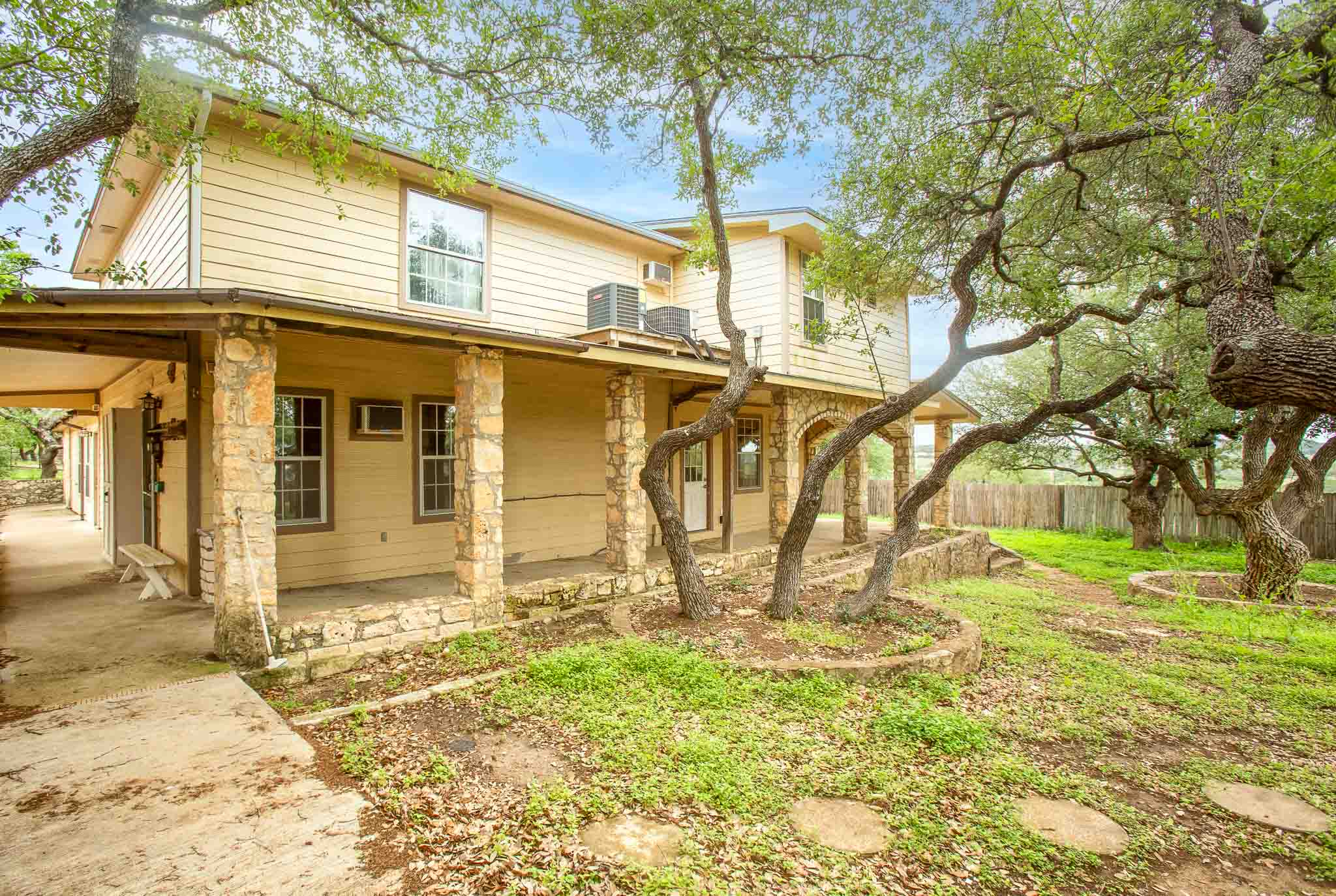 4525 Bell Springs Road Dripping Springs, TX 78620 - Photo 8 of 39 a view of a house with a yard