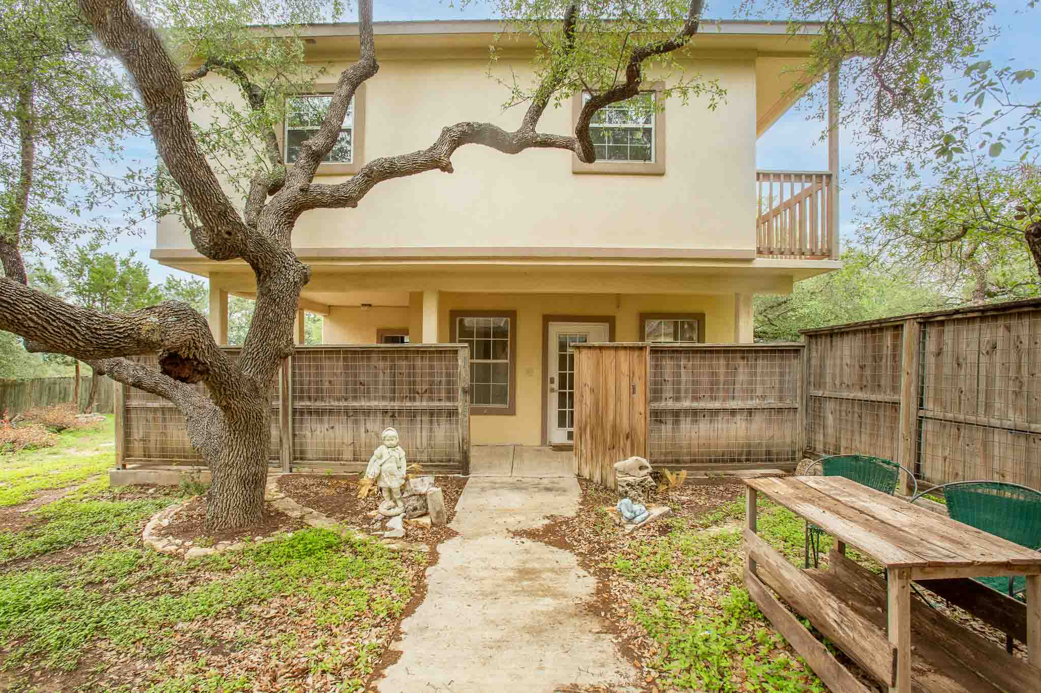 4525 Bell Springs Road Dripping Springs, TX 78620 - Photo 9 of 39 a backyard of a house with table and chairs