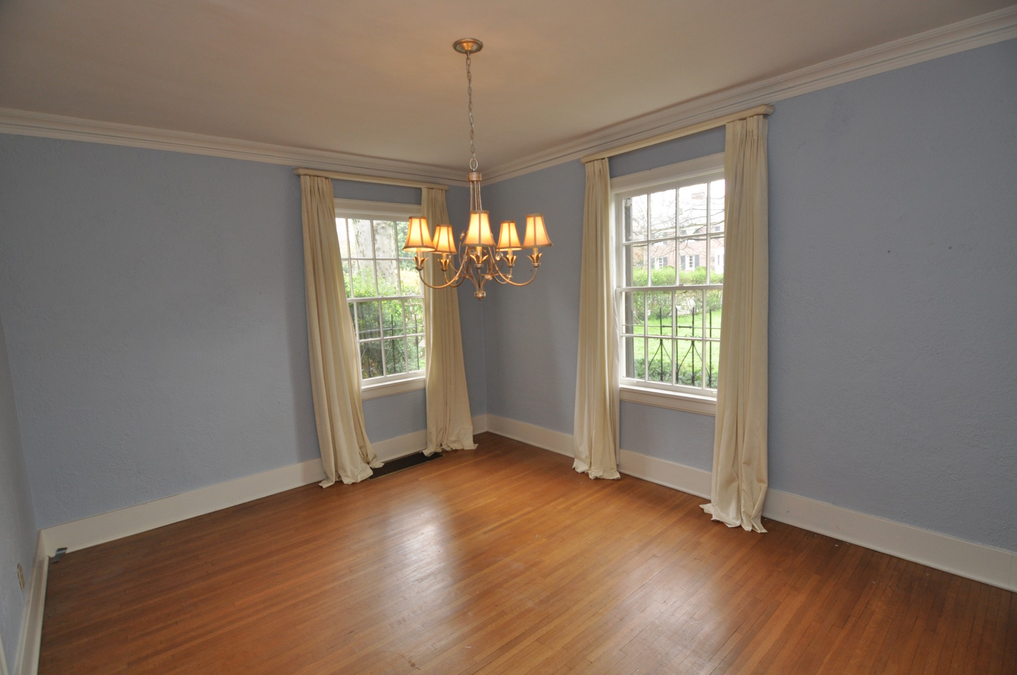201 Mockingbird Road Nashville, TN 37205 - Photo 9 of 49 a view of an empty room with wooden floor and a window
