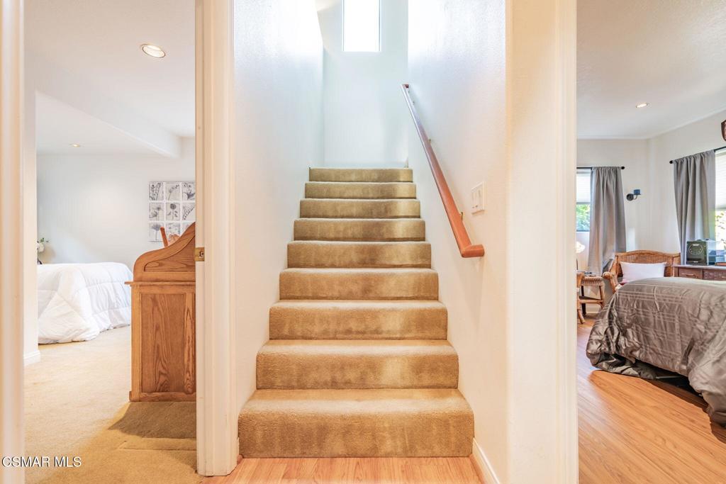 6078 Peppertree Lane Simi Valley, CA 93063 - Photo 31 of 59 a view of staircase with white walls and a rug