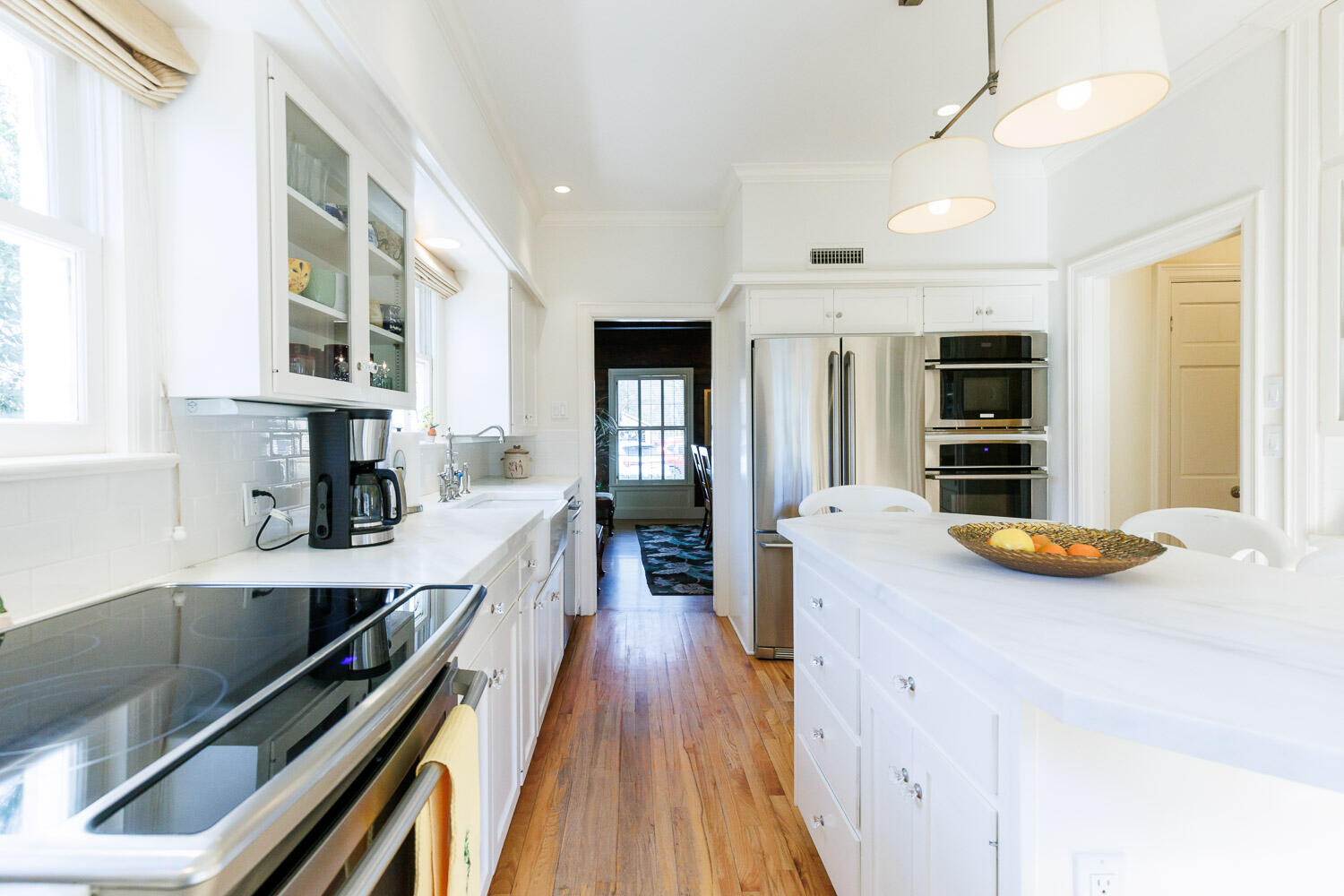 2607 22nd Street Lubbock, TX 79410 - Photo 17 of 87 a kitchen with kitchen island granite countertop lots of counter top space and wooden floor