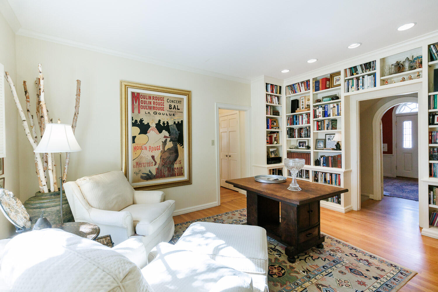 2607 22nd Street Lubbock, TX 79410 - Photo 21 of 87 a living room with furniture a table and a bookshelf