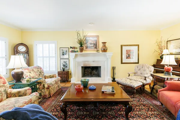 a view of a dining room with furniture and a chandelier