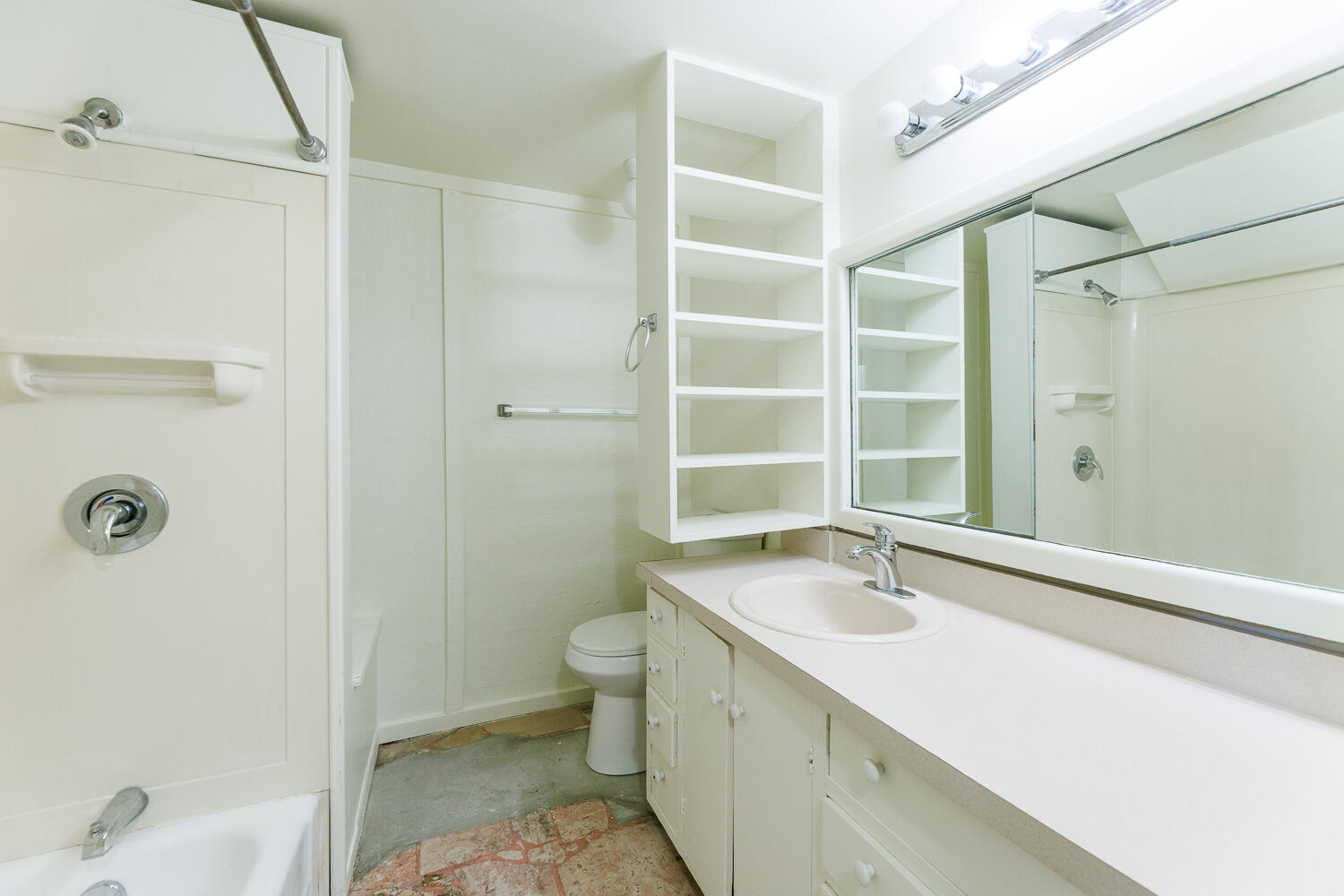 2607 22nd Street Lubbock, TX 79410 - Photo 79 of 87 a bathroom with a sink and a mirror