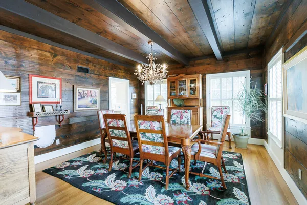 a kitchen with kitchen island granite countertop lots of counter top space and wooden floor