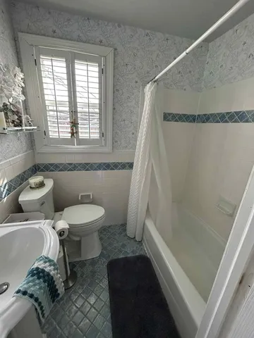 a bathroom with a sink and a toilet