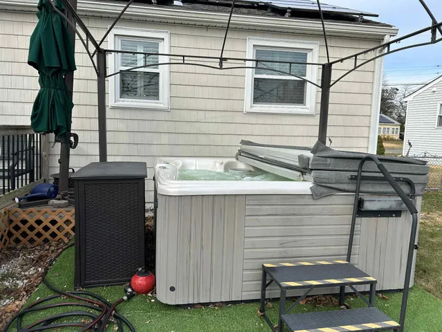 a view of a backyard with sitting area