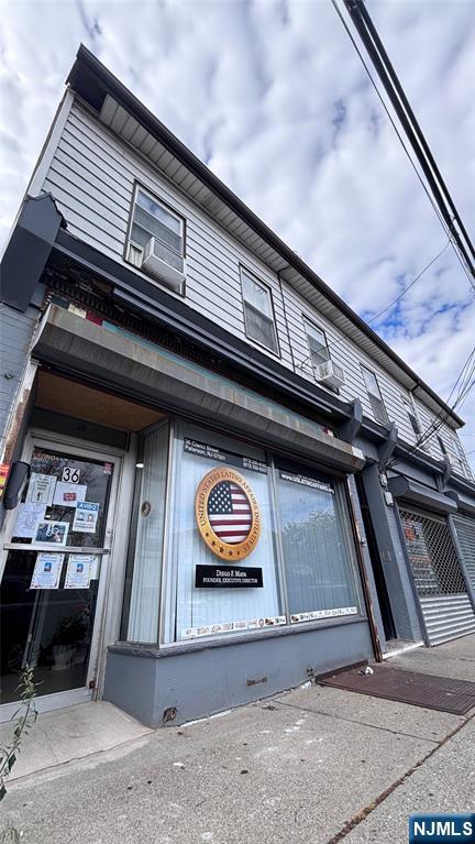 36 Cianci Street Paterson, NJ 07501 - Photo 1 of 9 a black and white building with black door