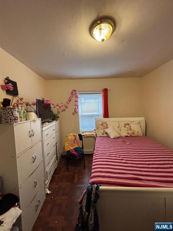 36 Cianci Street Paterson, NJ 07501 - Photo 7 of 9 a bedroom with a bed and a dresser in it