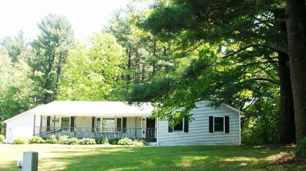 91 Groton School Road Ayer, MA 01432 - Photo 1 of 11 a front view of a house with garden