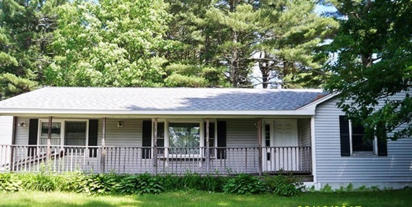 91 Groton School Road Ayer, MA 01432 - Photo 2 of 11 a front view of a house with garden
