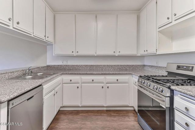 wooden floor fireplace and natural light in room