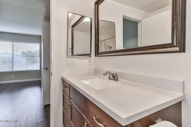 a view of a room with wooden walls
