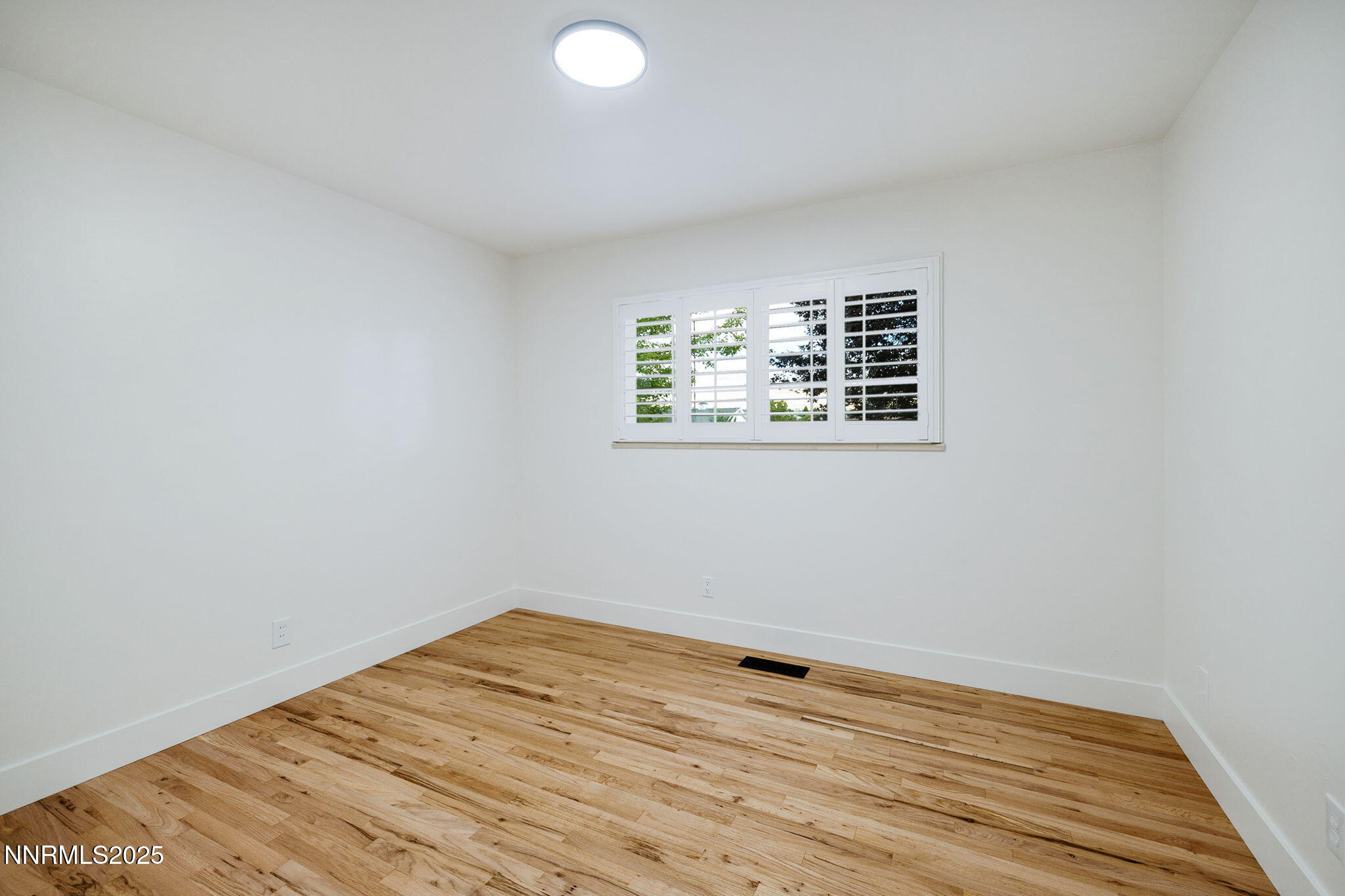 2024 Regent Street Reno, NV 89509 - Photo 18 of 32 an empty room with wooden floor and windows
