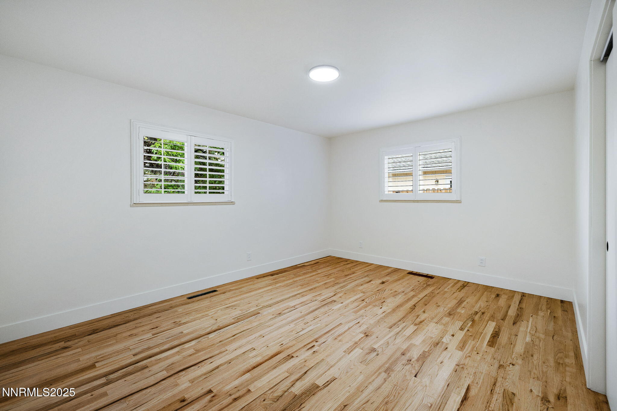 2024 Regent Street Reno, NV 89509 - Photo 21 of 32 a view of an empty room with wooden floor and a window