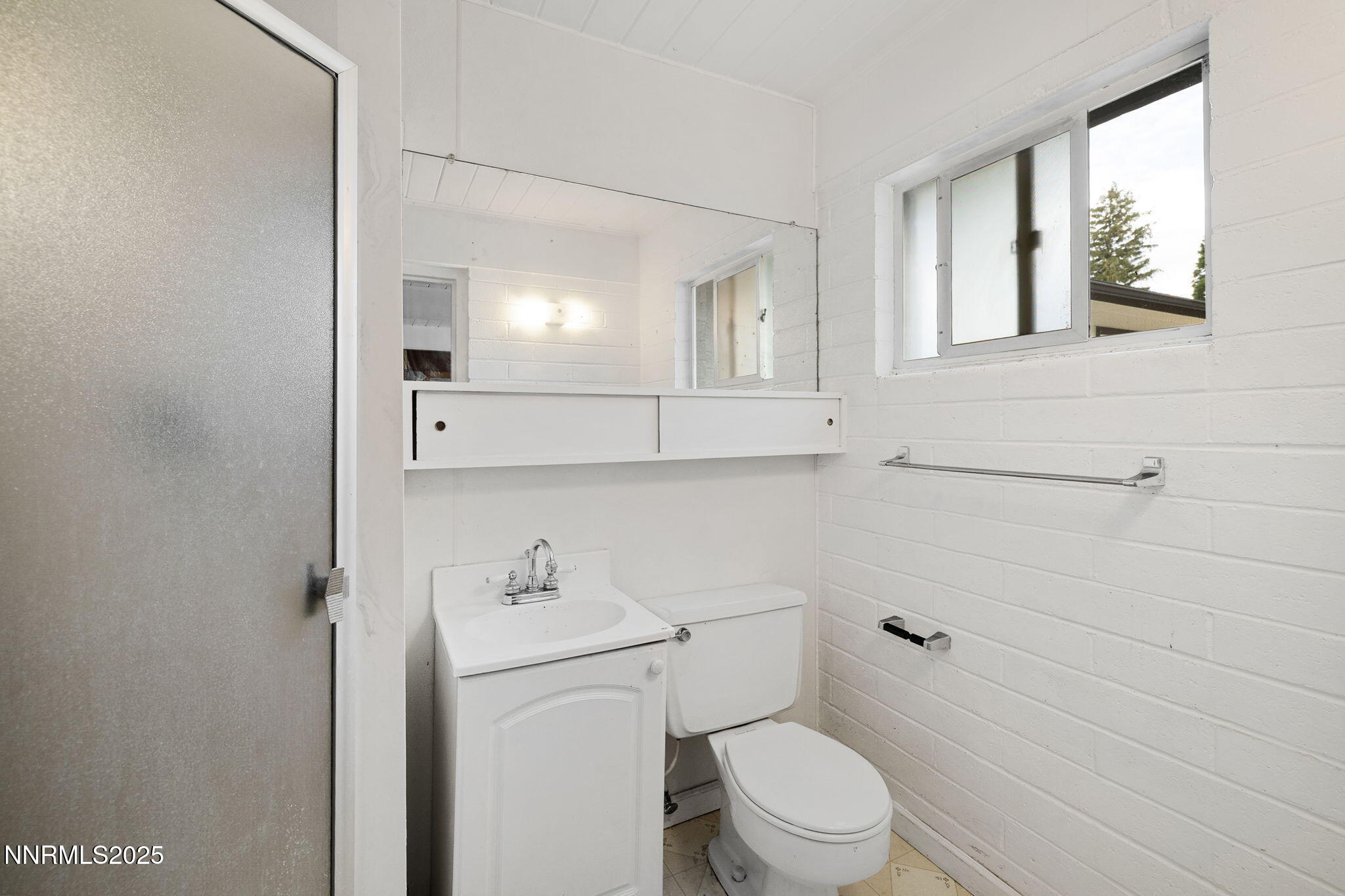 2024 Regent Street Reno, NV 89509 - Photo 27 of 32 a white toilet sitting next to a bathroom sink