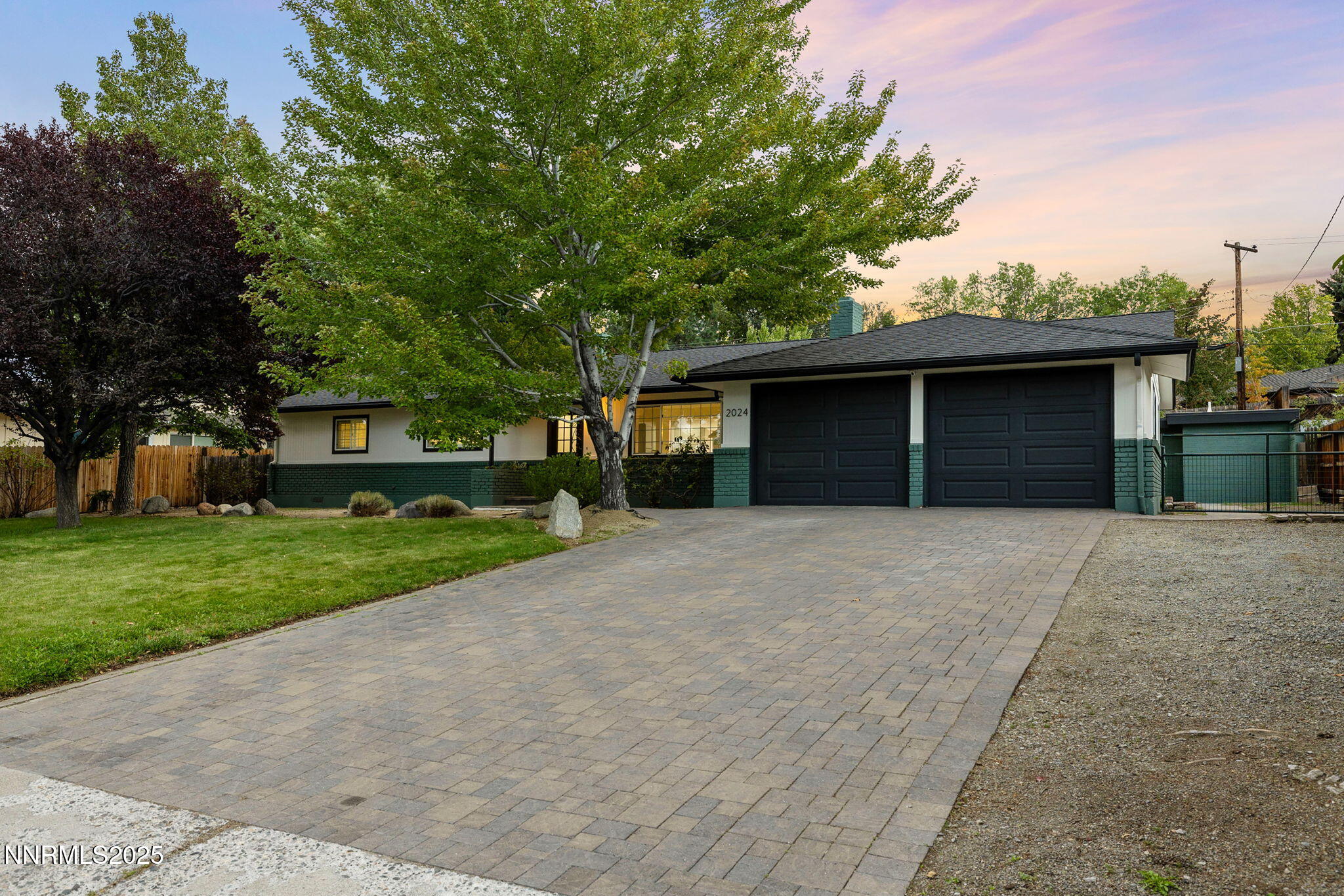 2024 Regent Street Reno, NV 89509 - Photo 29 of 32 a front view of a house with a yard and garage