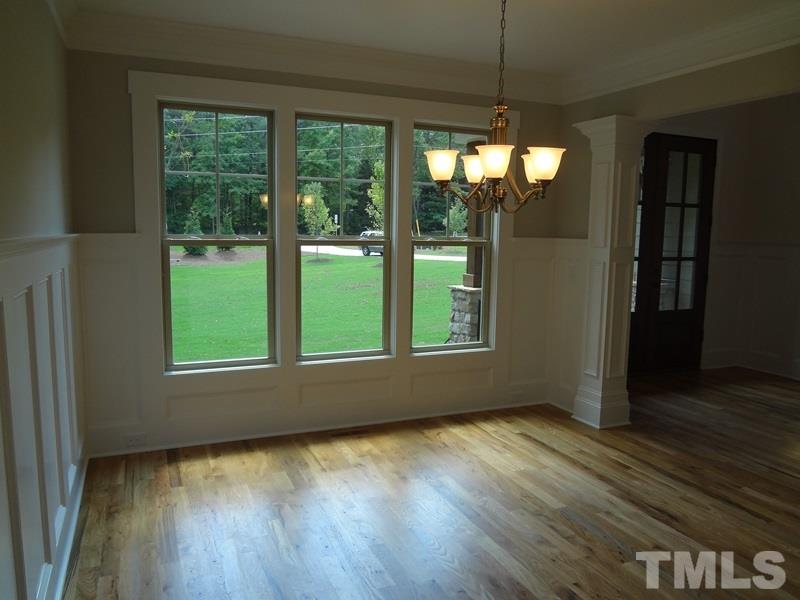 13800 Durant Road Raleigh, NC 27614 - Photo 8 of 25 a view of empty room with wooden floor and fan