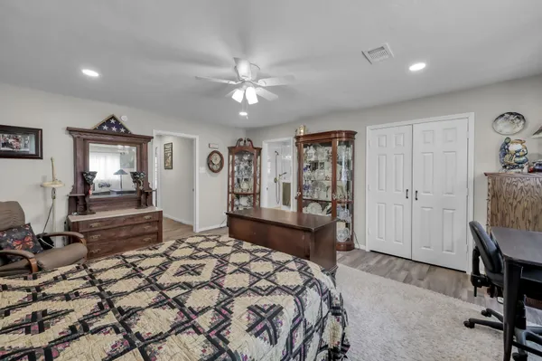 a living room with furniture and a book shelf