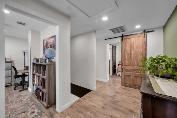 a spacious bathroom with a sink and a mirror