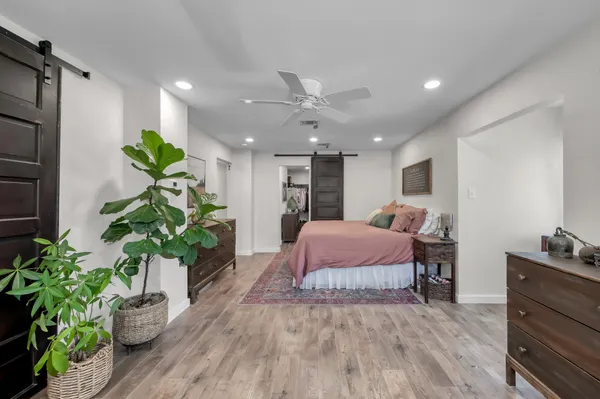 a room with lots of white furniture and closet