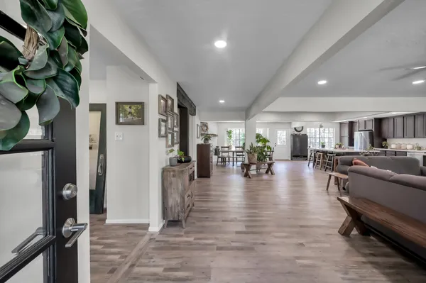 a living room with furniture a fireplace and a window