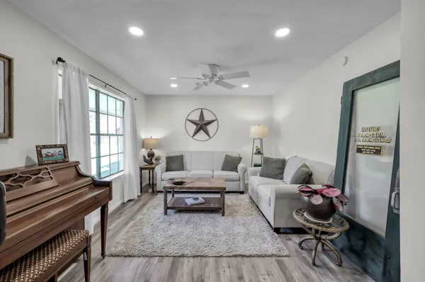 a living room with furniture and a large window