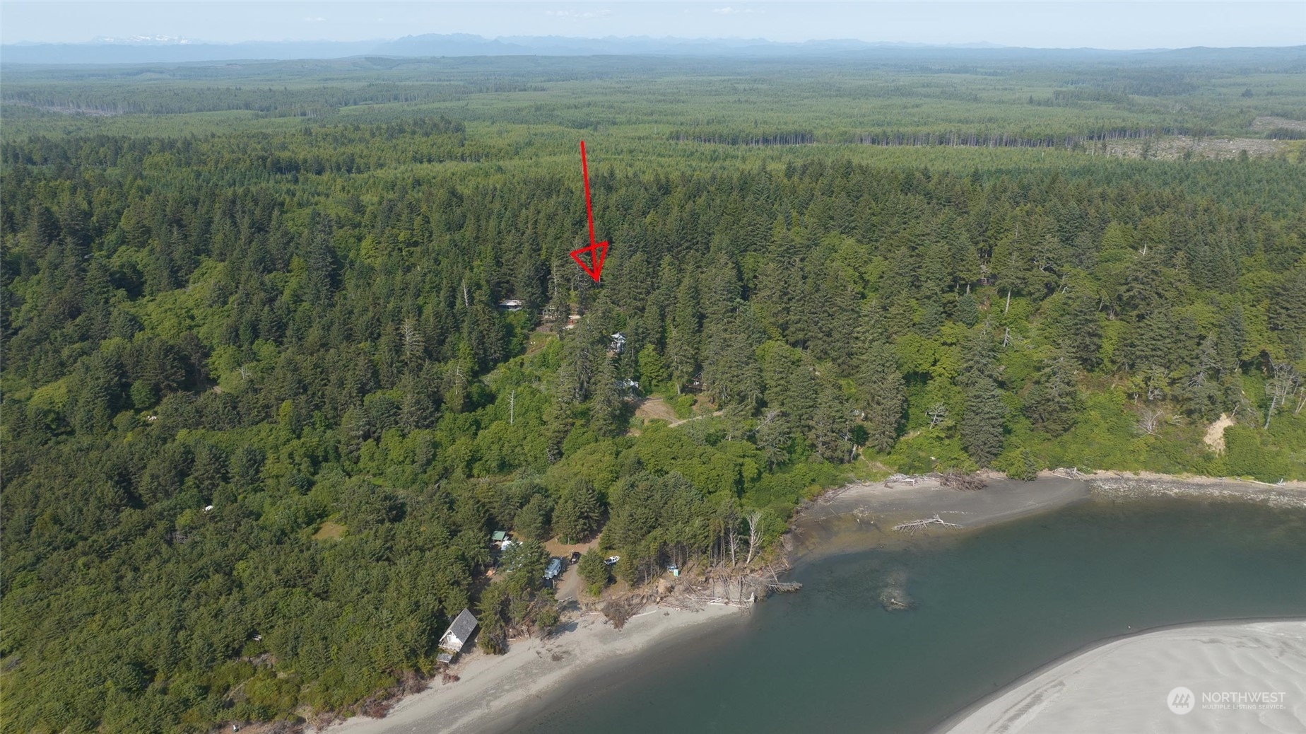 16 Ocean View Lane Copalis Beach, WA 98535 - Photo 5 of 39 a view of a lake with a yard and mountain in the back
