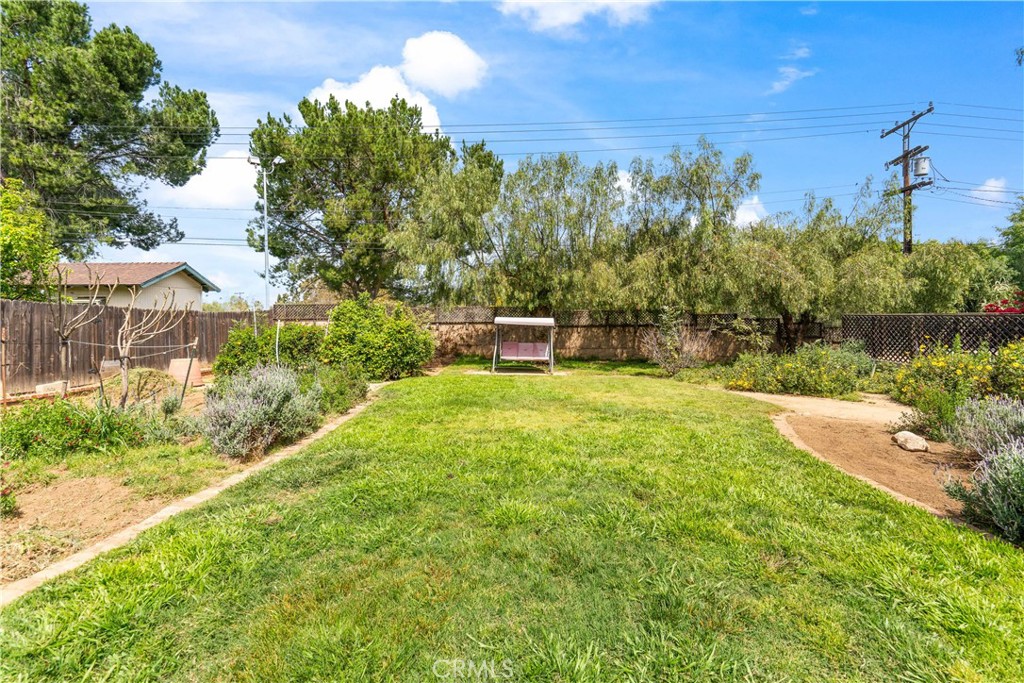 1965 Prince Albert Drive Riverside, CA 92507 - Photo 32 of 38 a view of a garden with a building in the background