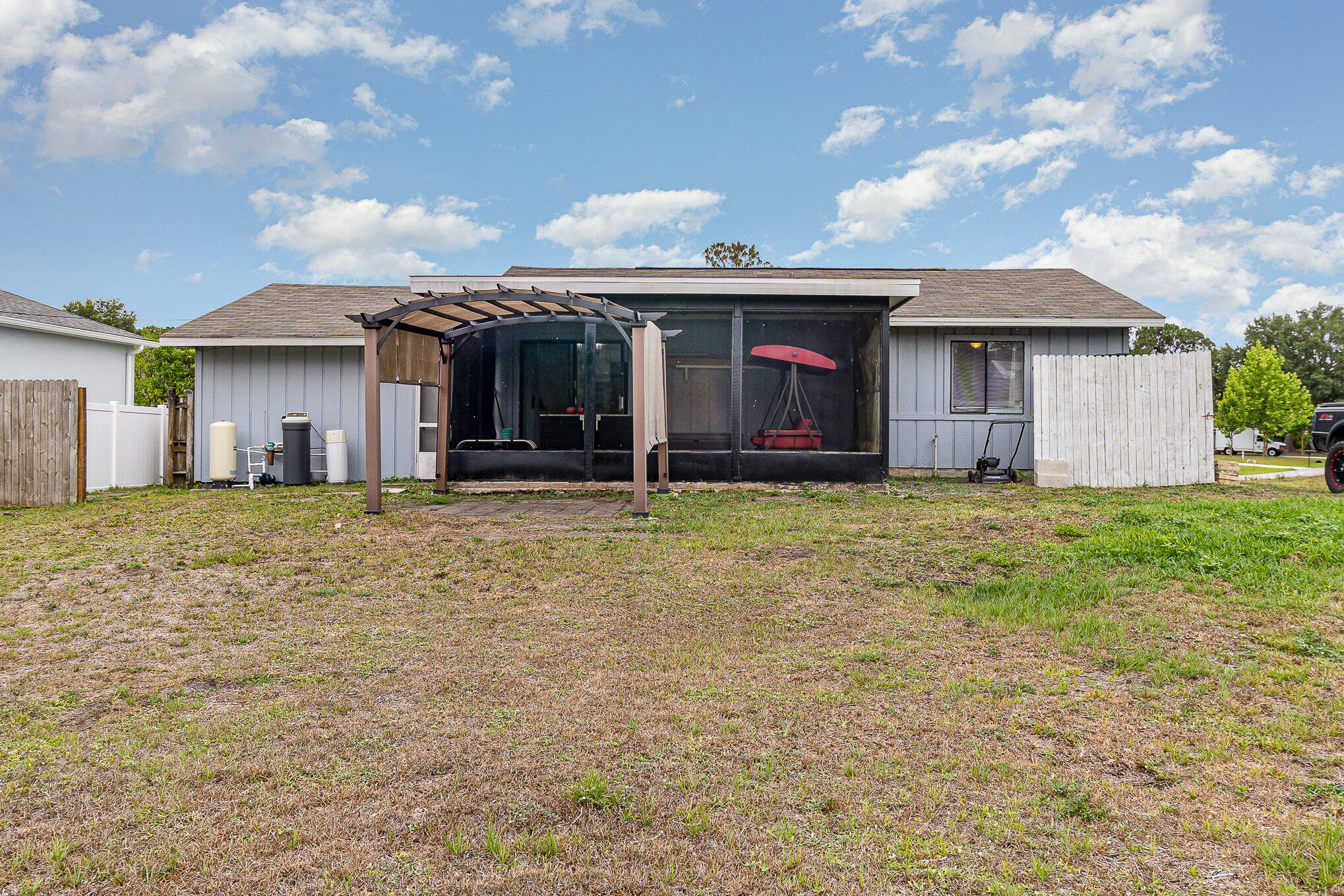 1021 San Rafael Road Southwest Palm Bay, FL 32908 - Photo 15 of 18 front view of a house with a yard