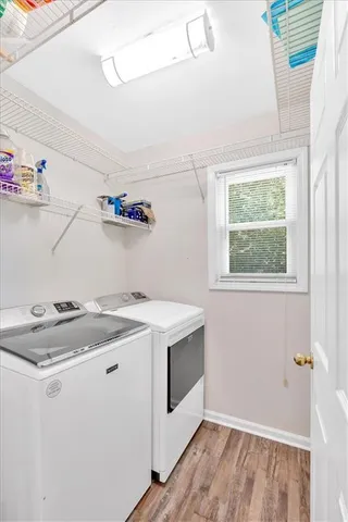 a utility room with sink dryer and washer