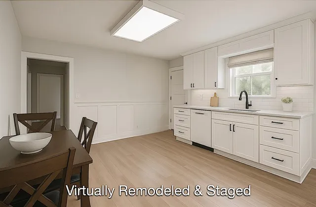 a spacious bathroom with a double vanity sink and a mirror