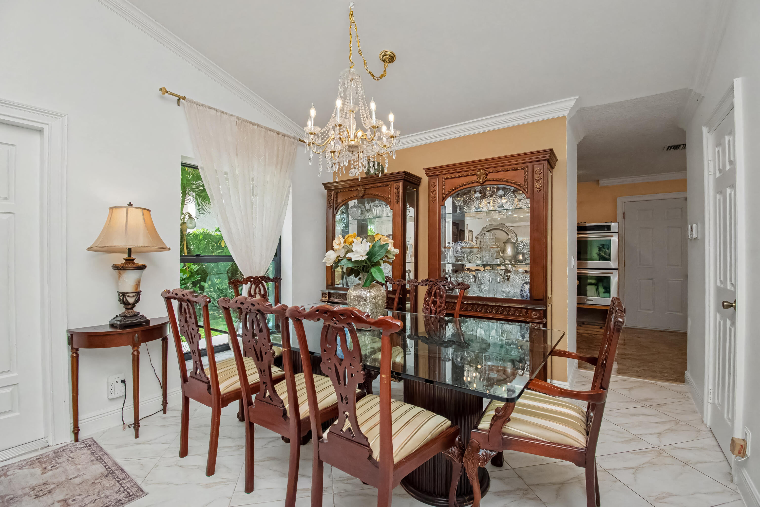 9708 Erica Court Boca Raton, FL 33496 - Photo 20 of 54 a view of a dining room with furniture window and outside view