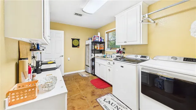 a bedroom with a bed couch and a window