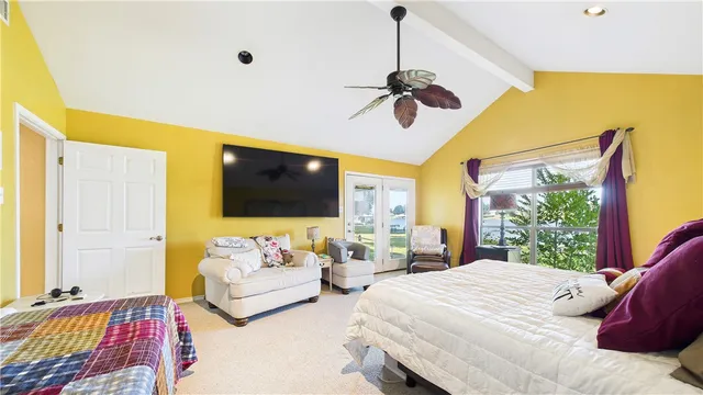 a bedroom with a bed and a couch